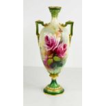 A Royal Worcester slender vase with twin handles, painted with roses all round, and green ground,
