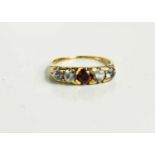 A 9ct gold, garnet and paste pendant five stone ring, 2.5g.