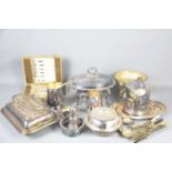 A quantity of silver plate to include trays, dishes with covers and other items.