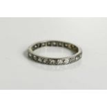 An Art Deco platinum and diamond eternity ring, with a full band of old cut diamonds, size K, 1.7g.