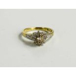 A 9ct gold and diamond flowerhead ring, size K, 2.1g.