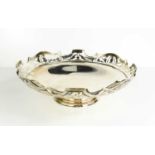 A silver pedestal dish, by Martin Hall & Co., with shaped and pierced rim, Sheffield 1918, 17.