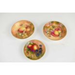 A pair Royal Worcester pin trays by Roberts, painted with fruit to a mossy ground, together with a