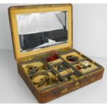 A vintage snakeskin travelling jewellery case, containing various jewellery, a 9ct gold crab claw