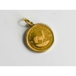 A South African 1/10 Krugerrand, mounted in a 9ct gold pendant, total weight 3.9g.