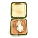 A vintage 9ct gold [tested as] cameo brooch with safety chain, 8.4g total weight.