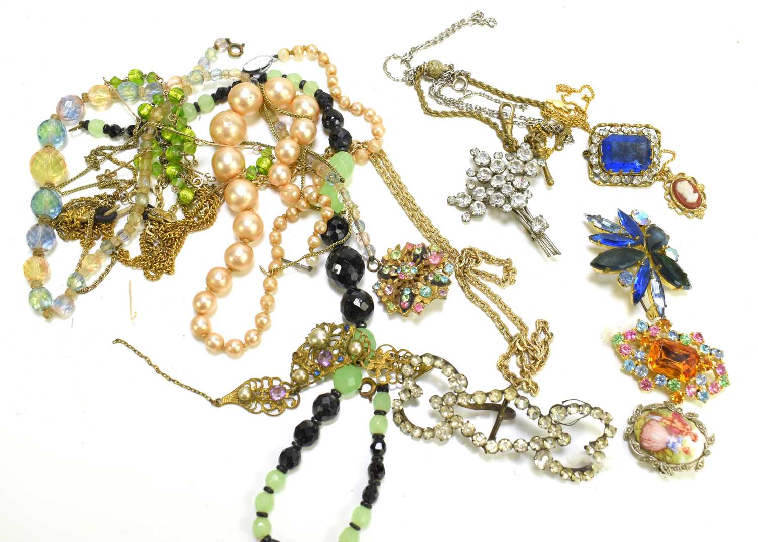 A group of vintage jewellery to include necklaces, brooches, porcelain cameo brooch, Albert chain