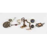 A group of jewellery to include a Victorian silver brooch engraved with a bird, a silver medal to