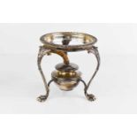 A silver kettle stand with original burner, the legs of foliate form terminating on paw feet, London