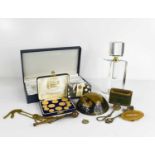 A group of collectables to include glass perfume bottles, military paperweight, a gentlemans golfing