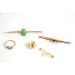 A 9ct gold bar brooch decorated with C scrolls and set with central blue paste stone together with a