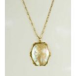 An antique mother of pearl cameo and 9ct gold pendant necklace, the oval mother of pearl depicting a