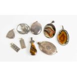 A group of silver jewellery to include two ingots, two agate and silver mounted pendants, lockets