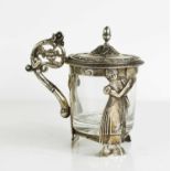 A Dutch silver and glass jar, the scrolling handle terminating with a cornucopia of flowers the body