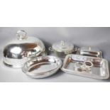 A group of silver plateware to include serving dishes, dome and pierced bowl and cover.