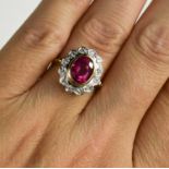 An 18ct yellow and white gold, pink tourmaline and diamond ring, size N, 6.2g.