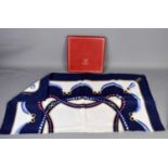 A Must De Cartier silk scarf having a blue ground with a pearl necklace themed design with