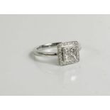 An 18ct white gold and diamond ring, the diamonds totalling approximately 0.05ct total, size L.