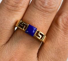An 18ct gold and lapiz lazuli ring, of Greek key design, size O, 4.5g.