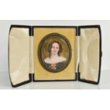 A French 19th century miniature portrait of a young girl with ringlet hair, 6 by 5cm, in a gilt