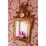A 20th century giltwood wall mirror, with crested top, 54cm by 86cm.