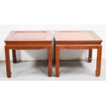 A pair of Chinese hardwood tables with square tops and caned decoration, 60cm by 60cm by 25cm.