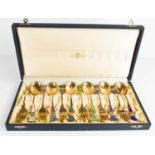 A set of silver and enamel fork & spoons by Jacob Tostrup of Norway, with gilt finish, in the