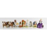 A group of porcelain figurines, to include Royal Doulton puppies HN2588, Beswick Beatrix Potter