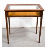 A 20th century mahogany vitrine table, with hinged glass top, square tapered legs, 64 by 62cm.