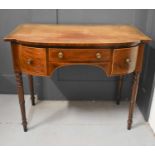 A 19th century mahogany bow front side table with three drawers set to the front and inlaid with