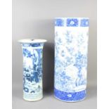Two 19th century Chinese cylindrical stick stands, one decorated with flowers, the other with