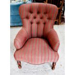 A button back armchair, in newly upholstered striped fabric, raised on mahogany turned legs.