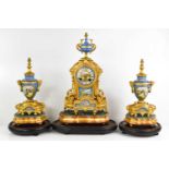 A late 19th century French clock garniture, by Brunfaut in the Louis XVI style, the gold coloured