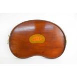 An Edwardian mahogany kidney shaped tray with brass handles and satinwood shell inlay, 57cm by