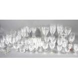 A large group of crystal and glassware of various shapes and sizes to include decanters.