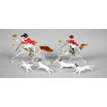 A Murano glass miniature hunting set, comprising two horse and riders, and four hounds.