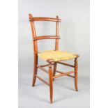 A 19th century rush seated childs chair, with outswept legs.