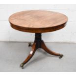 A Regency rosewood breakfast table, the circular top with plain frieze, on turned column and three