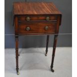 A 19th century mahogany work table with drop leaves and two graduated drawers, raised on bamboo