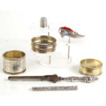 A group of silver items to include a silver shoe form pin cushion, silver thimble, silver handled