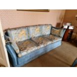 A pair of antique Knowle settees, upholstered in cornflower blue, and drop down sides surmounted
