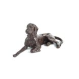 A bronzed figure of a Labrador, signed and dated to the base, 9cm high by 22cm.