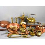 A group of brass and copper ware to include horse brasses, 19th century copper pan, trivet and other