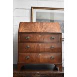 A 19th century mahogany bureau with a full front and fitted interior composed of satinwood fronted