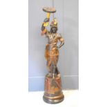 A 19th century Blackamoor holding a cornucopia with chinoiserie decoration throughout, 124cm high