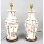 A pair of Chinese vases adapted to table lamps, the vases decorated with figural scenes and flowers,