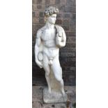 A reconstituted stone statue of a standing male "David" classical figure, 107cm high.
