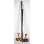A bog oak walking cane carved with shamrocks, and a further hedgerow stick, and a pair of wooden