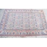A fine Persian wool rug, the ivory ground decorated with birds and fruit in blues, pinks and