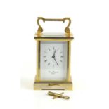 A brass cased carriage clock by Thomas Braithwaite of London, white enamel dial with Roman numeral